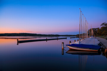 Obraz premium Scenic landscape of many sail boats at Kensington metro park in Michigan.