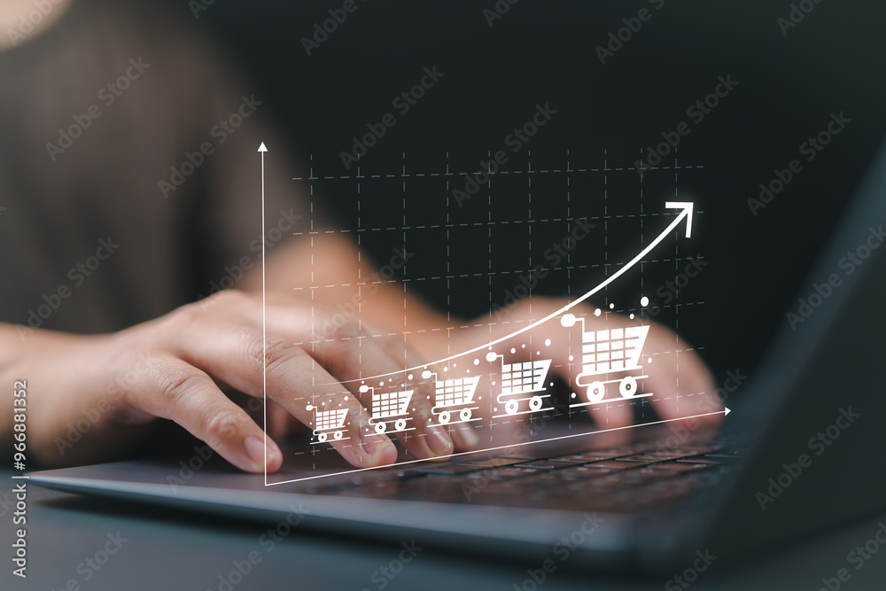 Aufkleber sale growth concept. businessman use laptop with graph of increase in sales volume with shopping car