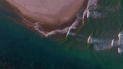 Ocean waves from above crashing onto the sandy shoreline and rivermouth Whangamata, Coromandel Peninsula, New Zealand. - Powered by Adobe