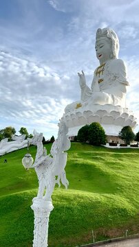 4K video footage of Wat Huay Pla Kang, or Temple of Goddess of Mercy, at Chiang Rai, Thailand. Big Guan Yin Buddha statue with its holy white temple, sitting on the hill mountain top.