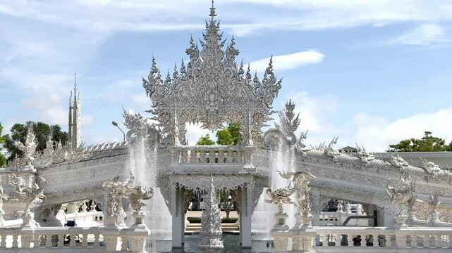Footage of White temple at Chiang Rai, Thailand, or Wat Rong Khun in Thai. White temple with its authentic Buddhist ornaments and engraving covered in all white paint.