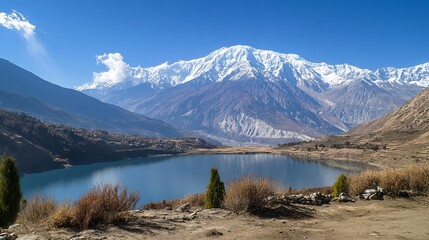 Dhumba Lake in Jomsom, set against the Himalaya Mountains in Nepal, part of the Annapurna Circuit trek