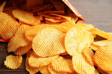 Potato chips in open bag, delicious BBQ seasoning spicy for crips, thin slice deep fried snack fast food.