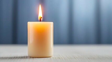Burning Candle on Wooden Table with Blue Background