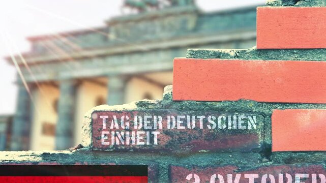 Eine Mauer in Berlin und Hinweis auf 3 Oktober Tag der deutschen Einheit
