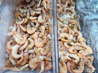 A display case of frozen shrimp at the store.