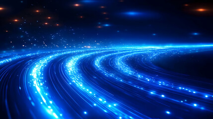 Fototapeta premium Abstract blue light trails with glowing particles creating a dynamic visual effect.