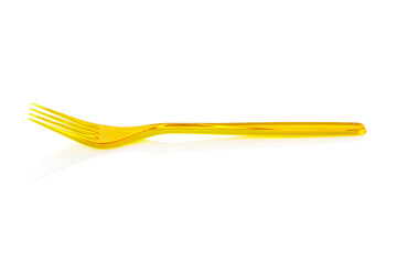 Disposable yellow plastic fork isolated on white background. Close-up. Full depth of field.