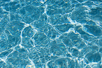 Blue ripped water in swimming pool, water pool texture and surface water backgraund.