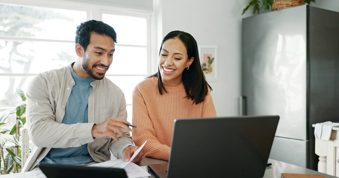 Kitchen, couple and discussion with laptop for budget, track expenses and planning for financial goals. Smile, man and woman with document for accounts management, handle savings and review at home