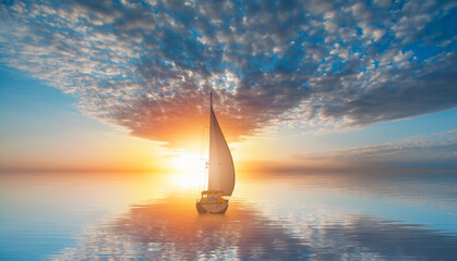 Lonely yacht sailing in the Mediterranean sea at amazing sunset - Sailing luxury yacht with white sails in the Sea.