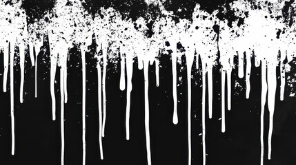 White paint drips down against a black background, forming unique and captivating patterns that showcase creativity and fluidity
