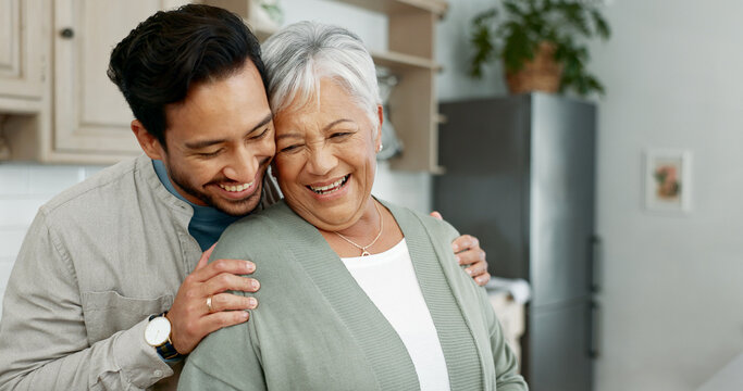 Home, senior mother and son with hug for care, comfort and assurance with bonding together in kitchen. Happy people, elderly mom and man with embrace for mothers day, support and expression of love