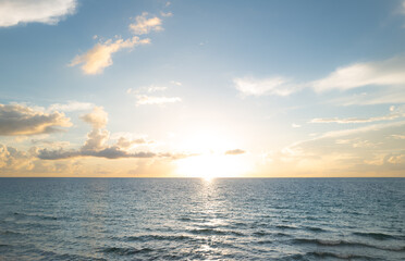 Obraz premium Sunrise sea on tropical beach. Landscape of beautiful beach. Beautiful sunset at sea. Ocean sunset on sky background with colorful clouds. Sunset over calm sea with beautiful sky.