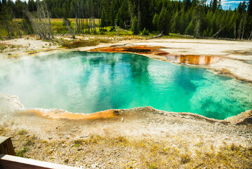 Image of Vibrant hot spring with turquoise water and orange mineral deposits. printed on Printed Glass Wall Art