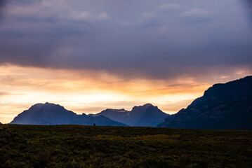 Dramatic sunrise over Lamar Valley, with mountains silhouetted.