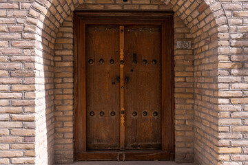 A wooden door with a number 36 on it