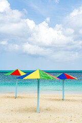Colorful beach umbrellas on sandy beach