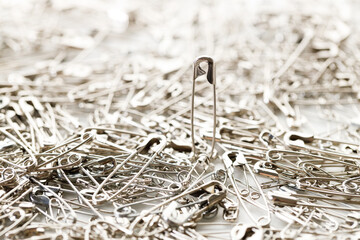 stainless safety pins. Selective focus.