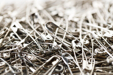 stainless safety pins. Selective focus.