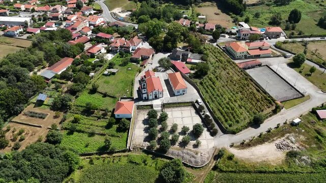 Aerial - Igreja Paroquial de Freixo, Ponte de Lima, with village and farmlands