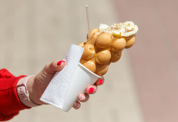 Close up of waffle ice cream in hand