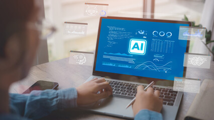 Artificial Intelligence Content Generator. A man uses a laptop to interact with AI assistant. AI...