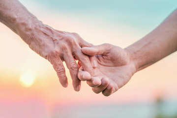 two hands holding each other