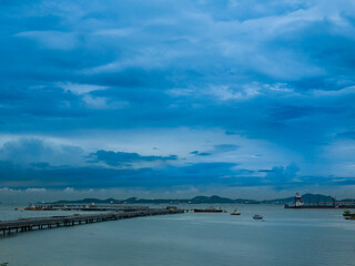 Obraz premium Logistic shipping quay boat Engineering crane depot at logistic export terminal control. Warehouse freight background container yard loading quayside harbor port. Logistics seascape shipping portal