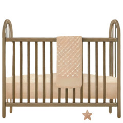 Baby crib with teddy bear pillow, blanket, and decorative ornaments. Sticker isolated on transparent background.