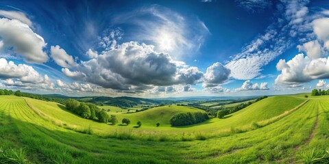 Obraz premium Wide green landscape with hills and amazing cumulus clouds fisheye view