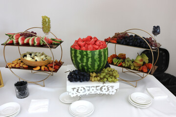 Watermelon and grapes on a sweet fruit table.