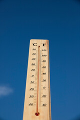 Thermometer shows high temperature in summer heat