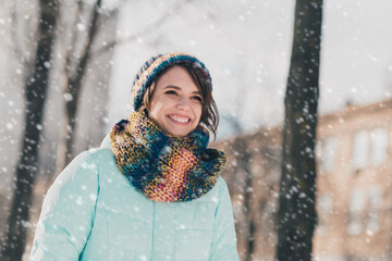 Photo of charming young attractive nice happy lady look away walk snow park good mood outdoors...