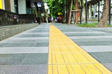 Tactile paving on sidewalk for blind handicap people