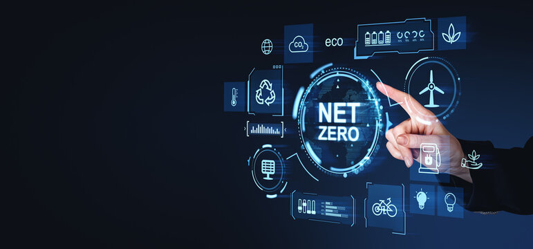 Hand pointing at a futuristic digital interface displaying Net Zero with various eco-friendly icons and symbols on a dark background, symbolizing renewable energy and green solutions
