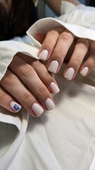 The beauty of the natural nails. Perfect clean manicure. New trendy nail arts on young women hand. Beautiful nail polish in hand