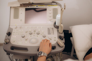 Close up of ultrasound machine in clinic. Health care, diagnostic and disease prevention concept. Modern apparatus medical equipment. Ultrasonography . No people