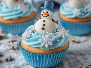 Winter wonderland cupcakes with blue and white frosting, snowflake sprinkles