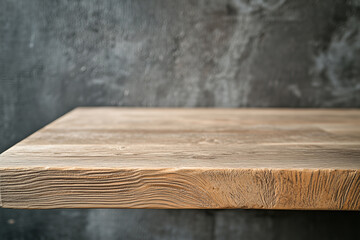 Empty wooden tabletop on blurred gray concrete background