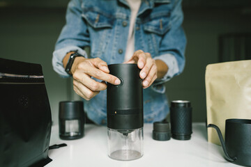 Coffee preparation, using Automatic grinder ground coffee beans, light roast Arabica, maker at home