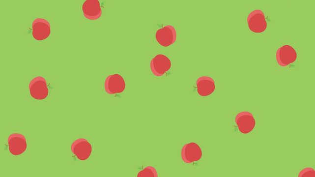 Animation of red apples moving on green background