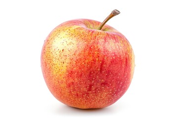 A single red and yellow apple sits on a white surface, perfect for food photography or still life compositions