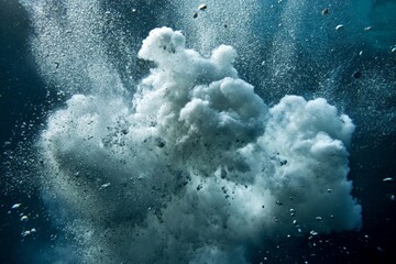 Obraz premium An underwater scene featuring a dramatic bubble ascending through dark blue water, creating a captivating visual effect with the interplay of light and bubbles.