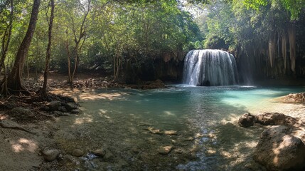 Obraz premium Serene natural waterfall flowing into a turquoise pool surrounded by lush green foliage in a tranquil forest setting.