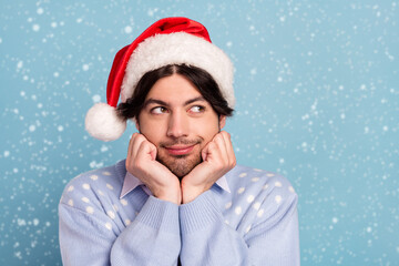 Photo of positive dreamy happy man look empty space imagine present christmas isolated on blue color background