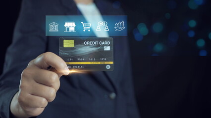 Businessman hand holding Credit card, online shopping concept, usage of credit card system, online financial institution for customers around the world.