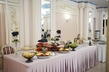 Fruit and berry buffet with watermelon, melon, cherry and grapes.