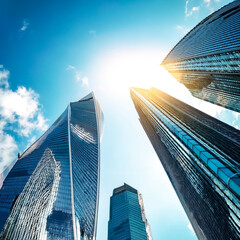 Vertical low angle shot of the skyscrapers under the bright sky