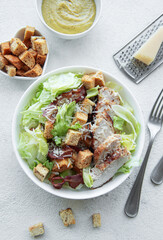 A bowl  of  Caesar salad
